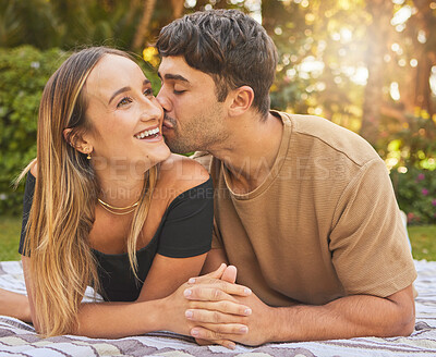 Buy stock photo Couple, holding hands with kiss and love in the park, picnic for bonding and happy in nature together. Support, trust and care with romantic date and outdoor fun, commitment and happiness.