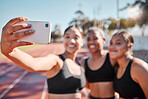 Selfie, smartphone and sports women group for fitness teamwork, collaboration and goal success update on social media, mobile app or web. Athlete friends in cellphone photography at a running stadium