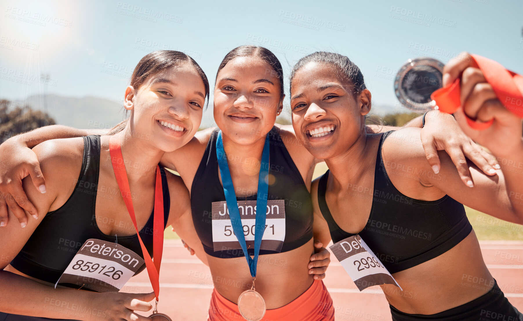 Buy stock photo Portrait, diversity and women with medals, for sports and winners on track, smile or victorious together. Champions, healthy girls or athlete happy with results on field, running victory or happiness