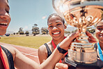 Winner, trophy and track team celebrate olympic relay teamwork, sprint competition or marathon race victory. Award, goal achievement and success celebration for athlete friends, runner or black women