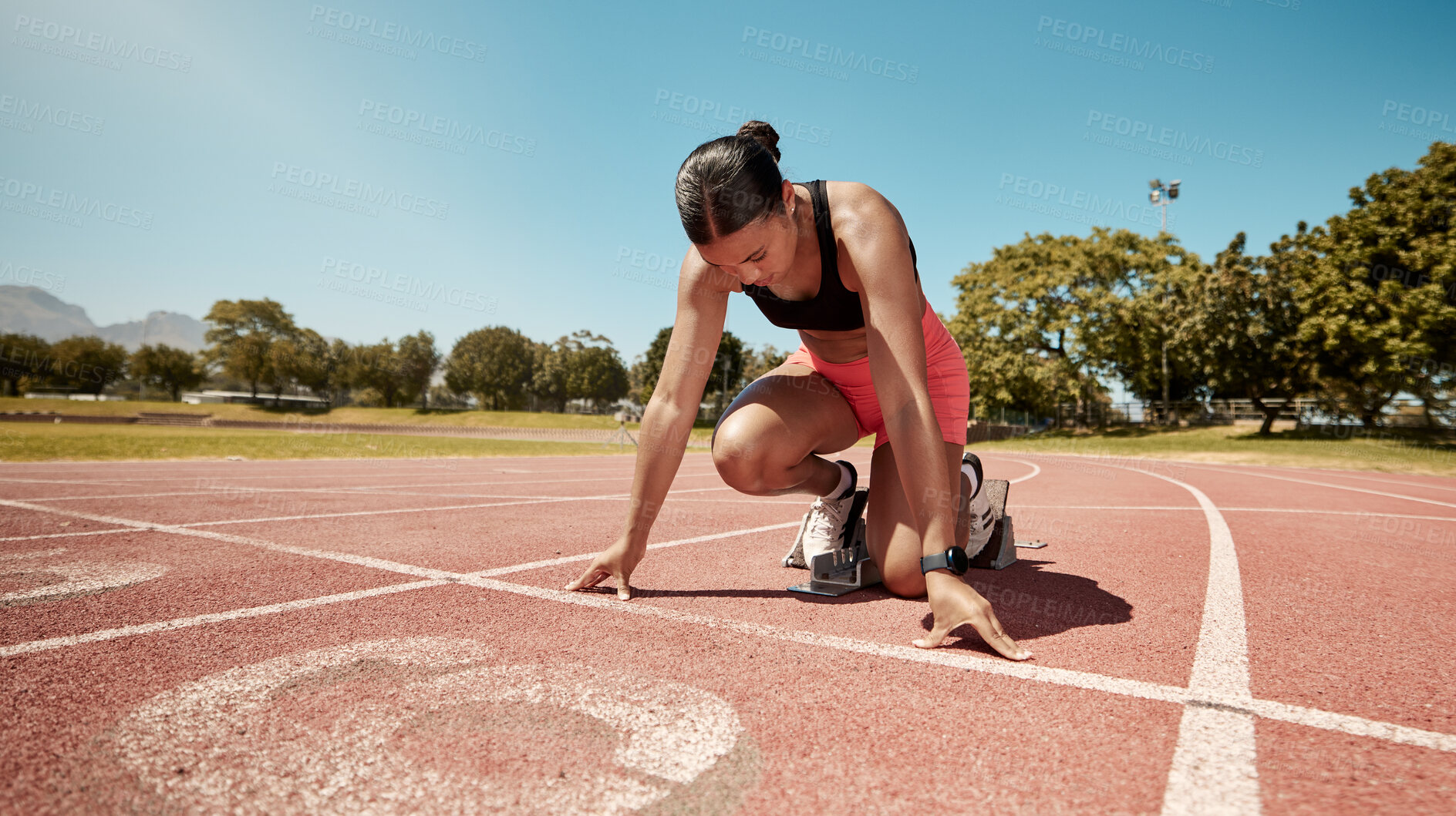 Buy stock photo Runner, stadium and fitness with woman start for running race, training and cardio on outdoor track. Competition, exercise and run for sport, marathon and sprint with workout motivation and endurance