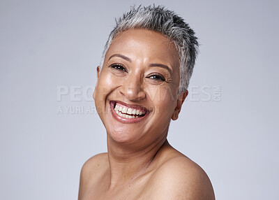 Buy stock photo Smile, happy and portrait of a senior woman with hair, skin and wellness against a grey mockup studio background. Health, skincare and face of an elderly model with happiness for makeup in retirement