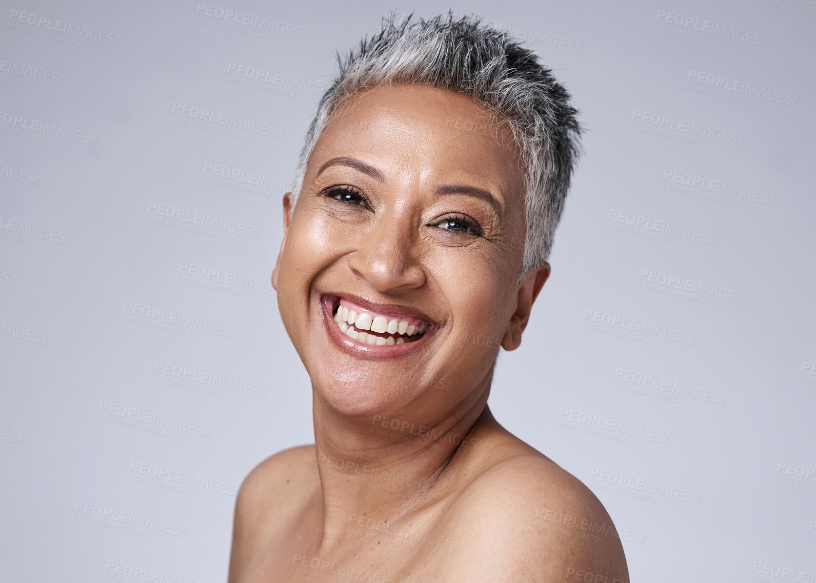 Buy stock photo Smile, happy and portrait of a senior woman with hair, skin and wellness against a grey mockup studio background. Health, skincare and face of an elderly model with happiness for makeup in retirement