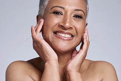Buy stock photo Skincare, health and wellness of senior woman, face and beauty against a grey studio background. Dermatology, smile and cosmetics model in retirement with care for skin, cosmetology and happiness