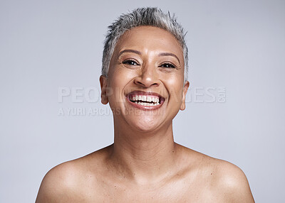 Buy stock photo Beauty, skincare and happy senior woman with natural makeup, wellness and cosmetic health with a smile in a grey studio background. Elderly model happy with cosmetics, face and dermatology result