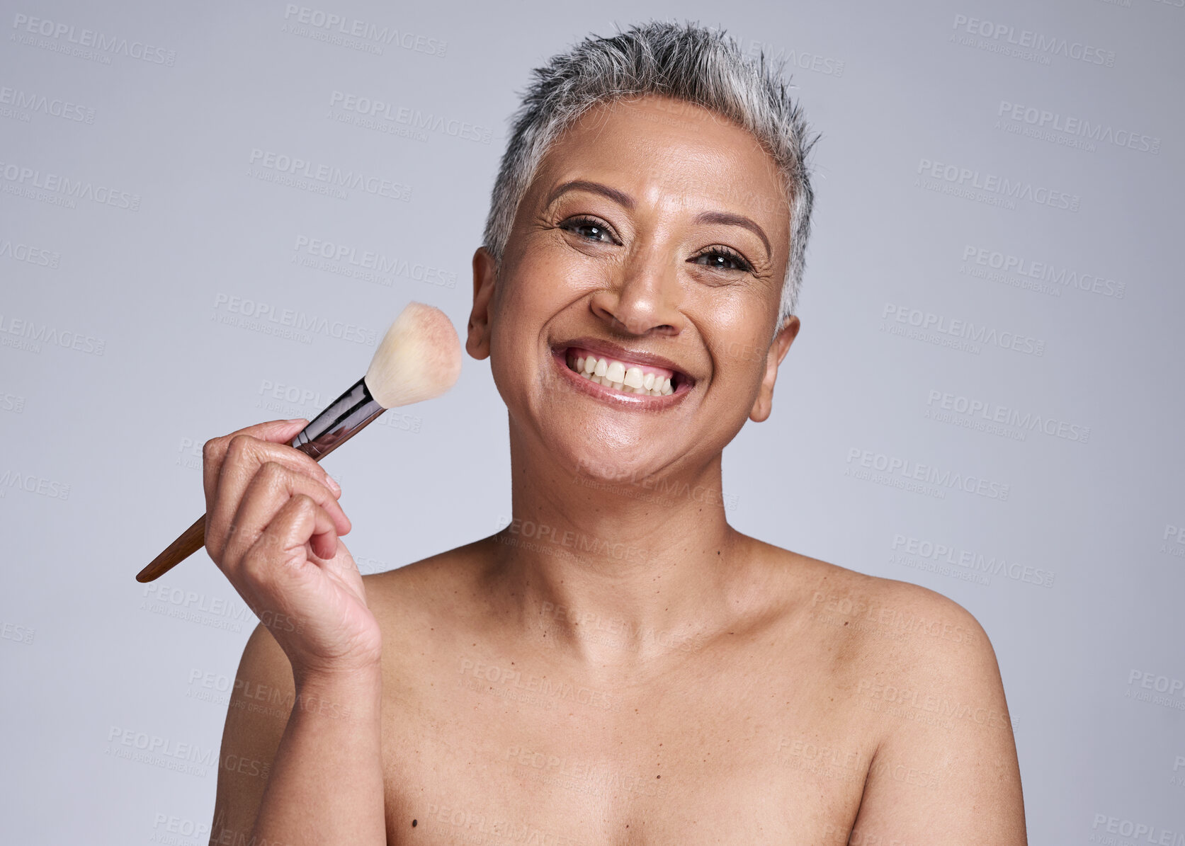 Buy stock photo Beauty, makeup and brush with senior woman for product, luxury and cosmetics. Foundation, blush and salon with portrait of mature model and smile for product self care, wellness and cosmetology