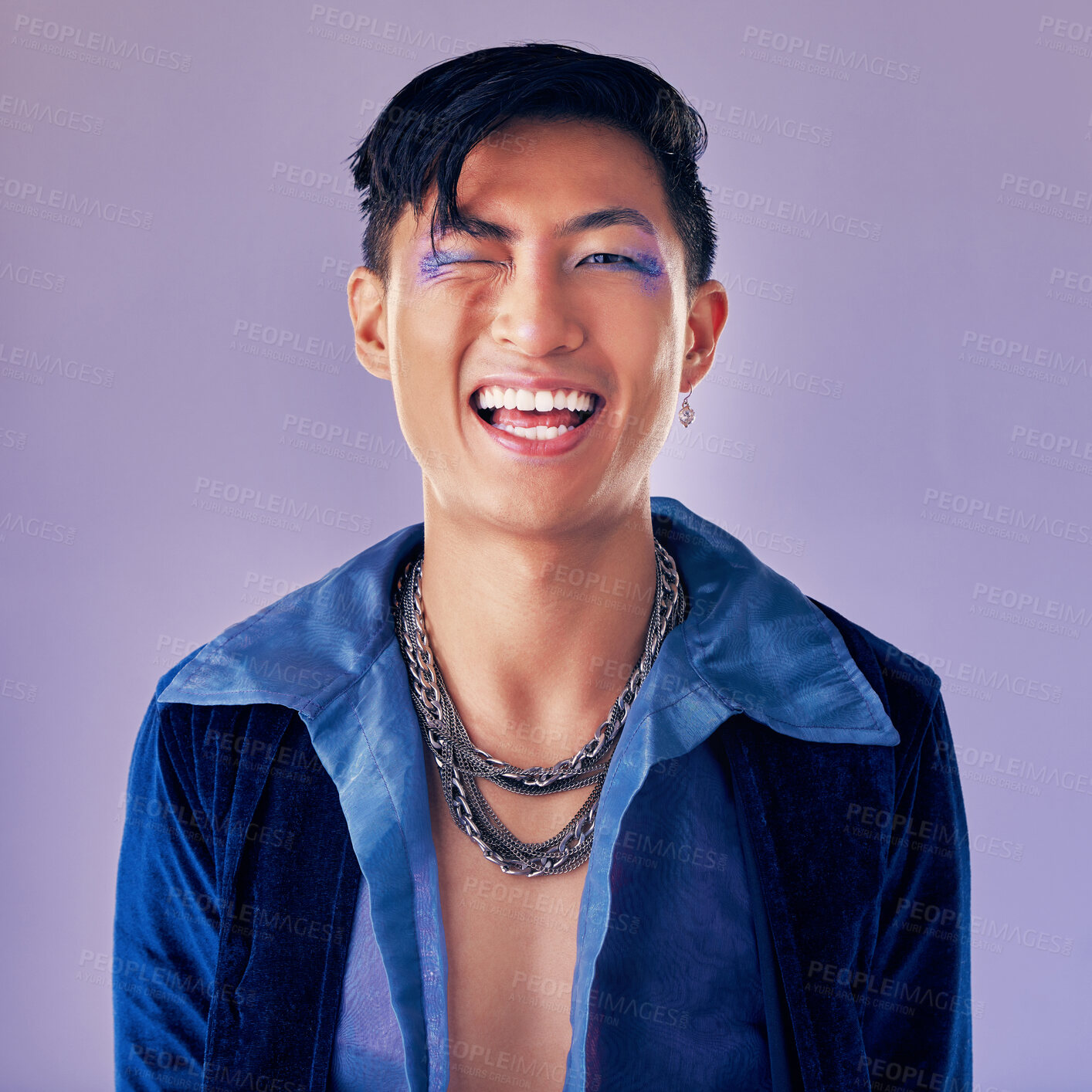 Buy stock photo Punk, rock and makeup of a man with a smile for metal music, lifestyle and identity against a purple studio background. Freedom, crazy and face portrait of a cyberpunk Asian person with cosmetics