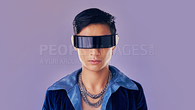 Buy stock photo Face, cyberpunk and virtual reality with asian man in futuristic eyewear in studio on purple background for metaverse or 3d fashion. Portrait, robot and future of young male in glasses for fantasy ai