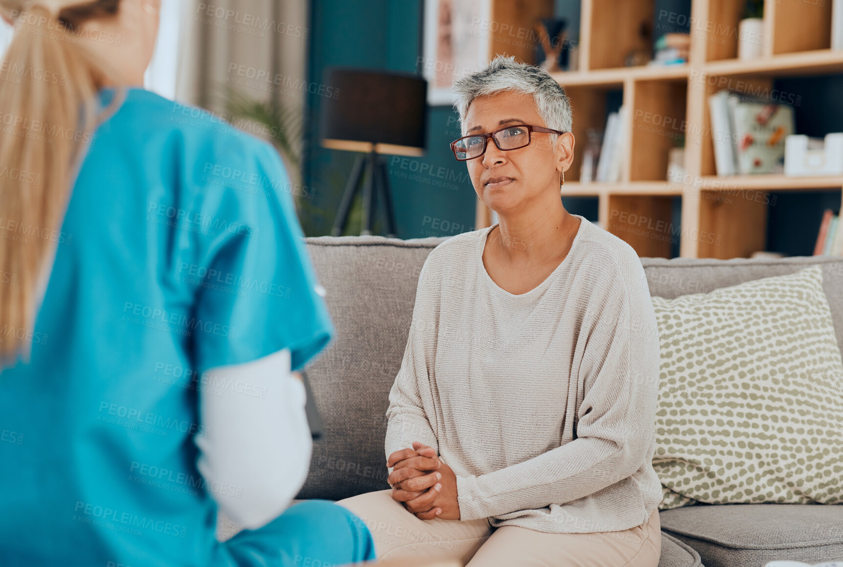 Buy stock photo Nurse, senior woman and consultation on sofa in home for health check up or examination. Healthcare, consulting and female doctor with elderly patient in living room discussing treatment options.