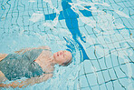 Elderly woman, swimming and pool with backstroke, float and cardio training for fitness, wellness and physical health. Senior swimmer, water workout and physical therapy in retirement for healthcare