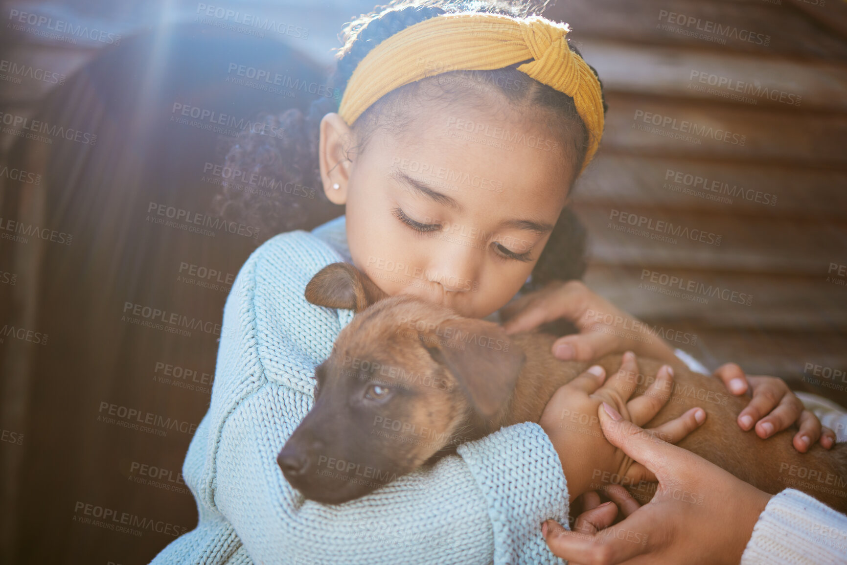 Buy stock photo Dog, kiss and child outdoor with a love hug, care and animal friend care for new family puppy. Pet, girl and happiness together of a relax animal and kid hugging with parent help feeling calm in sun