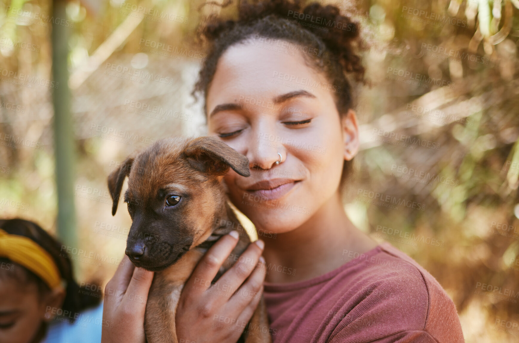 Buy stock photo Love, dog and animal shelter with a black woman hugging a foster pet while at a shelter to adopt a rescue animal. Volunteer, charity and adoption with a female holding a cute puppy at the pound