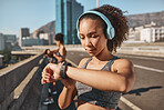 Smartwatch, headphones and fitness black woman in city with running results, workout progress check and goals. Young runner or sports girl with smart watch and music tech for outdoor training app