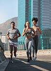 Diversity, fitness friends and running together in city for freedom or healthy lifestyle motivation. Runner athlete, sports training team and wellness coach outdoor workout for cardio exercise goal