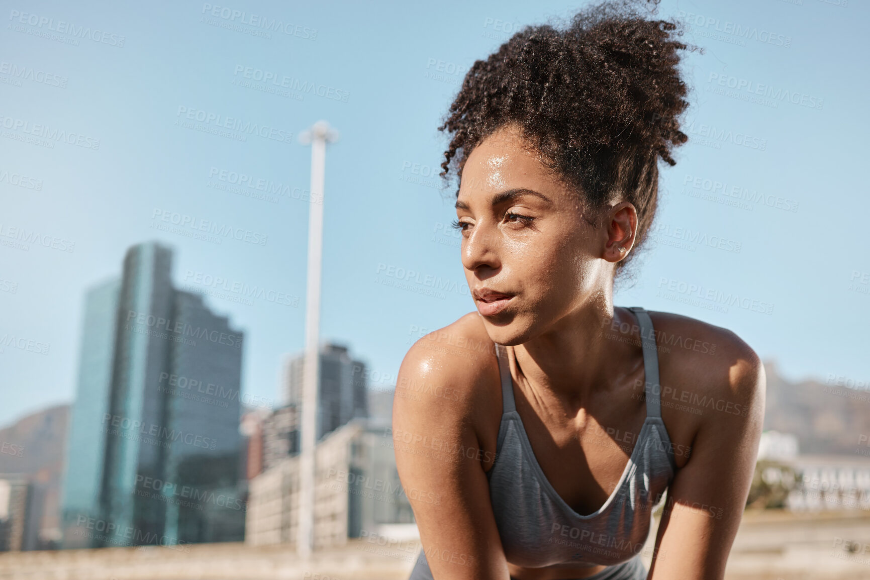 Buy stock photo Fitness, runner and tired black woman in a city sweating from running exercise, cardio workout or training. Breathing, fatigue and sports athlete relaxing or resting on a break on a sunny summers day