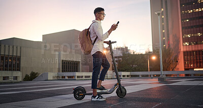 Buy stock photo Creative student, electric scooter or man with phone is city, street or building at night networking, 5g network or social media. Travel, designer or male with smartphone for contact us or media app