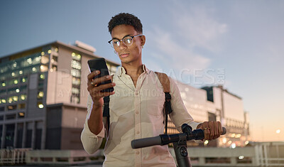 Buy stock photo Scooter, smartphone and man in city at night texting, scroll social media and GPS map technology for street directions. Modern university student, cellphone text message and mobile web communication 
