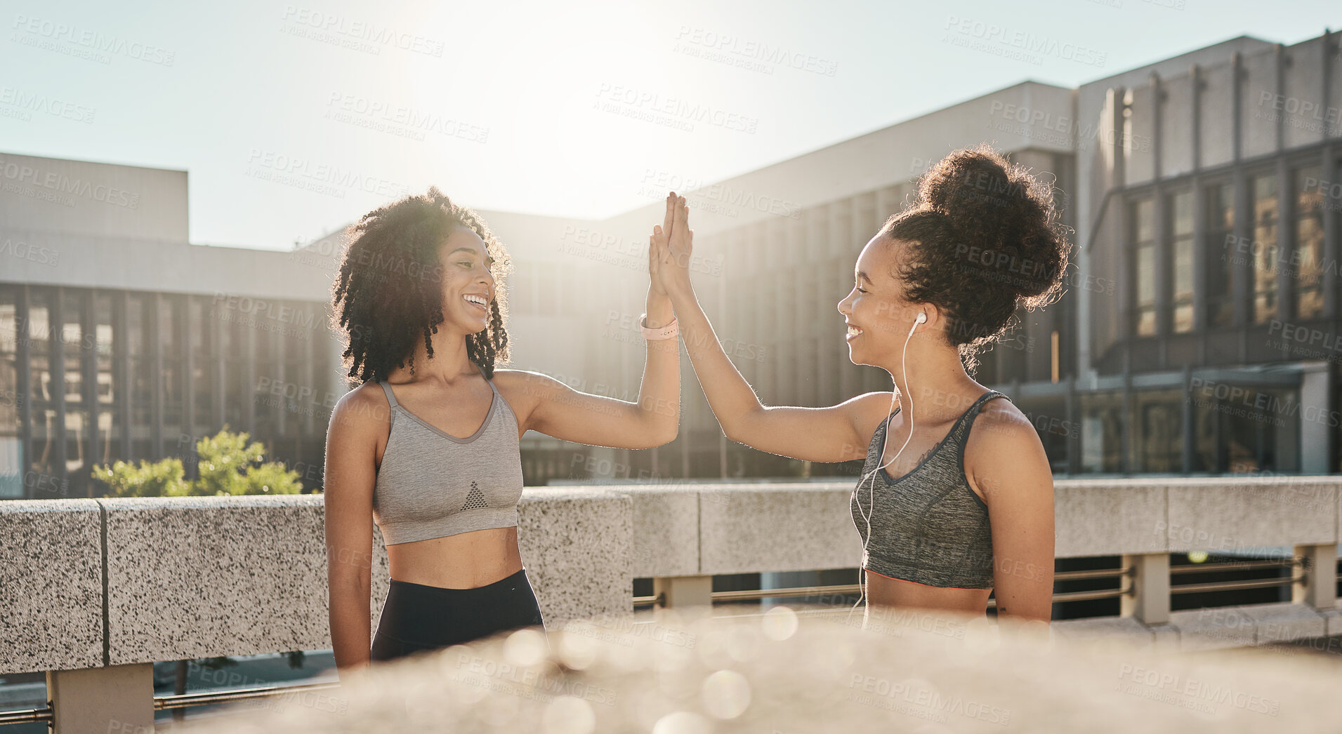 Buy stock photo Fitness, friends and high five in the city for exercise, training or workout together in the outdoors. Happy women in partnership touching hands for sports support, success or healthy cardio wellness
