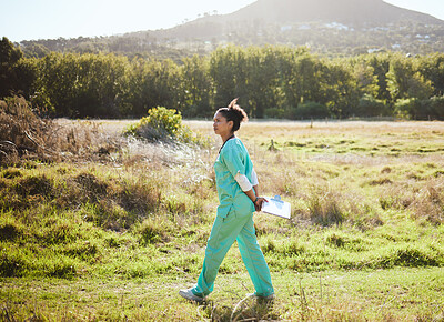 Buy stock photo Animal care, working and vet in field walking with clipboard doing research, analytics and inspection. Healthcare, veterinary and black woman medical worker doing work, examination and job in nature