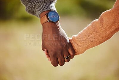 Buy stock photo Parent, child and holding hands for care, love and support in trust, relationship and walk together in the park. Hand of father or mother with kid walking for family time and safety in the outdoors