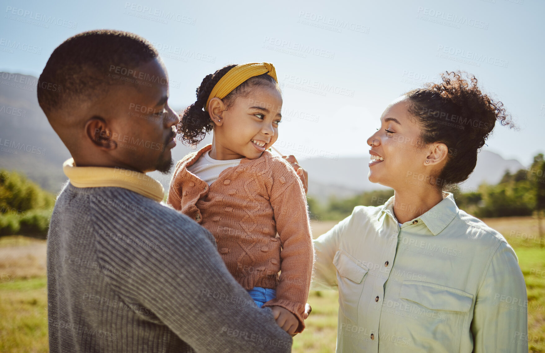 Buy stock photo Black family, love and relax at park, nature or outdoors on vacation, holiday or trip. Diversity, care or mother, father and girl enjoying quality time together or bonding in healthy morning sunshine