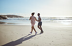 Outdoor couple, running and beach in summer sunshine for health, fitness and wellness in morning. Healthy, man and woman on sand for workout, exercise or training by ocean together for runner talk