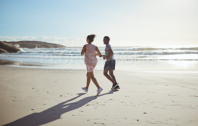 Buy stock photo Outdoor couple, running and beach in summer sunshine for health, fitness and wellness in morning. Healthy, man and woman on a workout, exercise or training by ocean together for runner at sunset