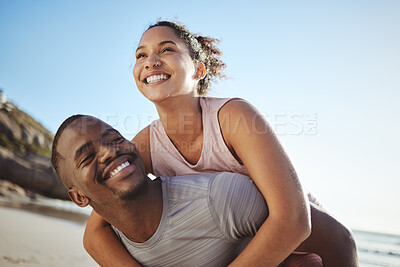 Buy stock photo Black couple, beach and fitness with a piggy back ride for fun, energy and freedom while on vacation with happiness, love and support. Smile of man and woman on holiday by sea for a fun, summer