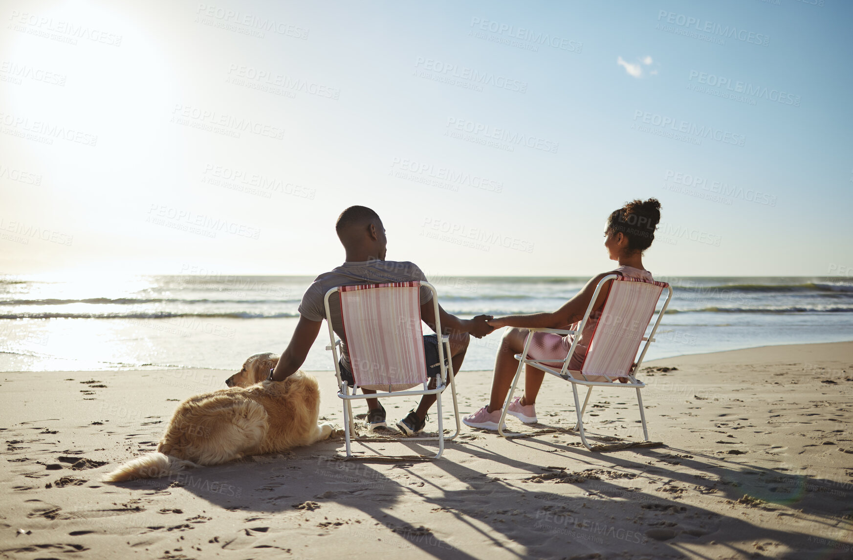 Buy stock photo Love, dog or black family holding hands by the beach, ocean or sea for sunset talking, bonding or relax on summer day. Family, travel or black woman and man for trust, support or vacation with sunset