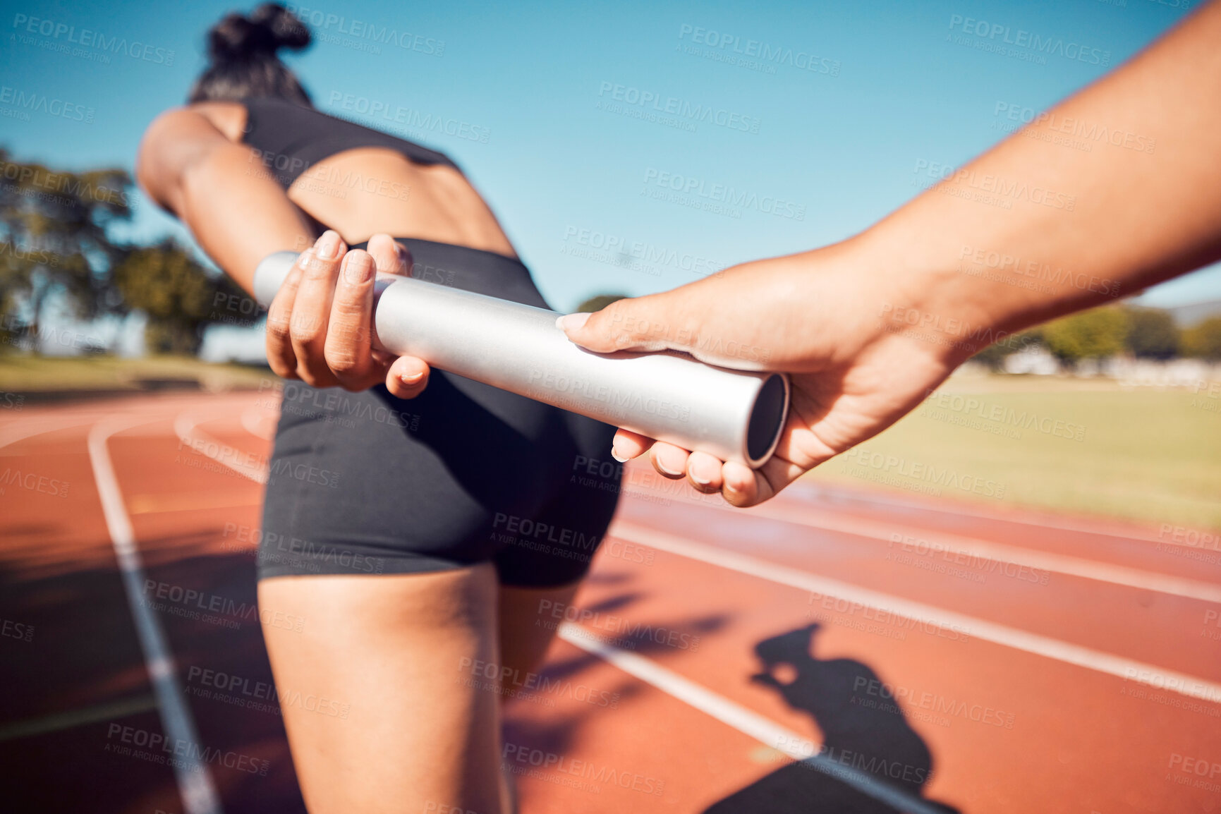 Buy stock photo Fitness, woman and hands on baton for relay sports, training or running competition on the stadium track. Active female in athletics sport holding bar for competitive race, sprint or team marathon