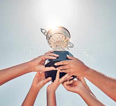 Buy stock photo Women, hands or sports trophy in fitness success, workout game or exercise match on summer blue sky. Low angle, team and winner prize cup for school community, training health or wellness award goals