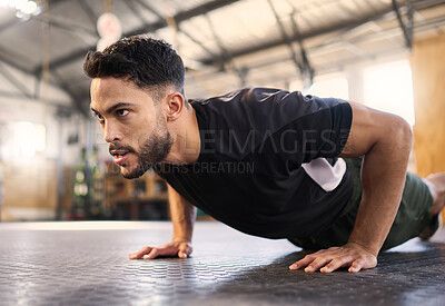 Buy stock photo Fitness, training and push up with man in gym for training, muscle and workout endurance. Determination, strong and power with bodybuilder and floor exercise for sports, wellness and athlete