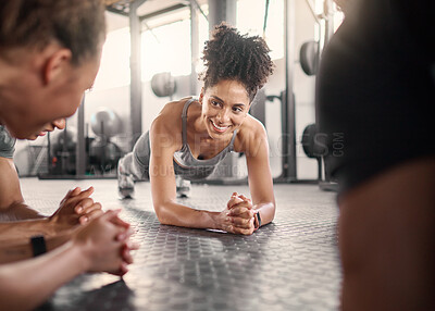 Buy stock photo Happy black woman, group and plank in gym for health, fitness and wellness with strong core on floor. Friends workout, abdominal exercise and training collaboration with smile, support and diversity