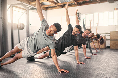 Buy stock photo Fitness, exercise and training with a sports group stretching together in gym class for health or wellness. Workout, diversity and coach with a team warmup in a sport facility for performance