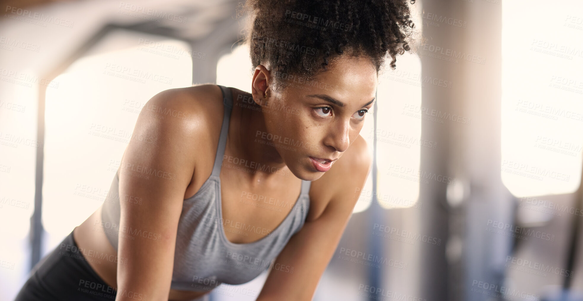 Buy stock photo Gym, training and tired black woman breathing after exercise, workout and sports fitness. Woman in a health and wellness club breathe and relax after intense athlete challenge with focus