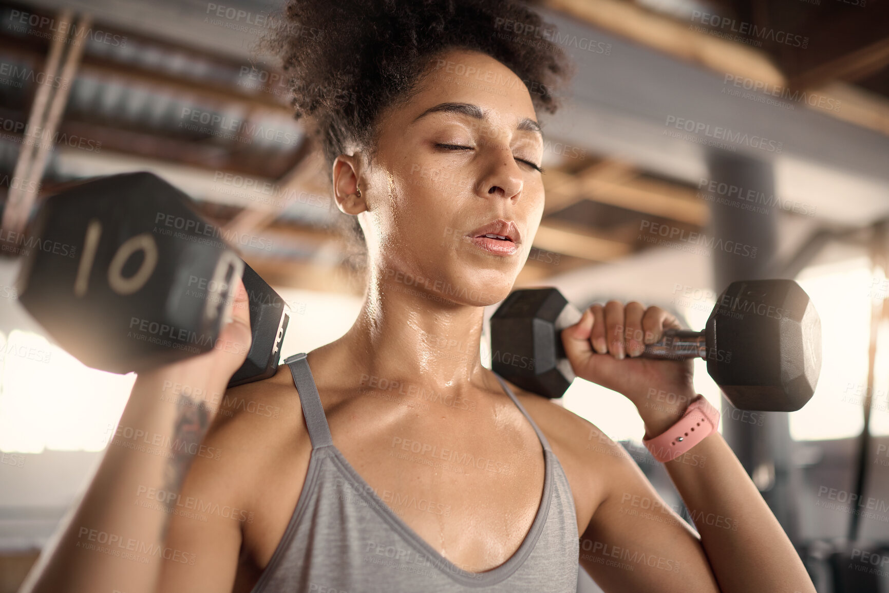 Buy stock photo Fitness, exercise and dumbbell with a black woman athlete training in a gym for strong health or wellness. Sports, motivation and workout with a female bodybuilder in a sports club for a workout