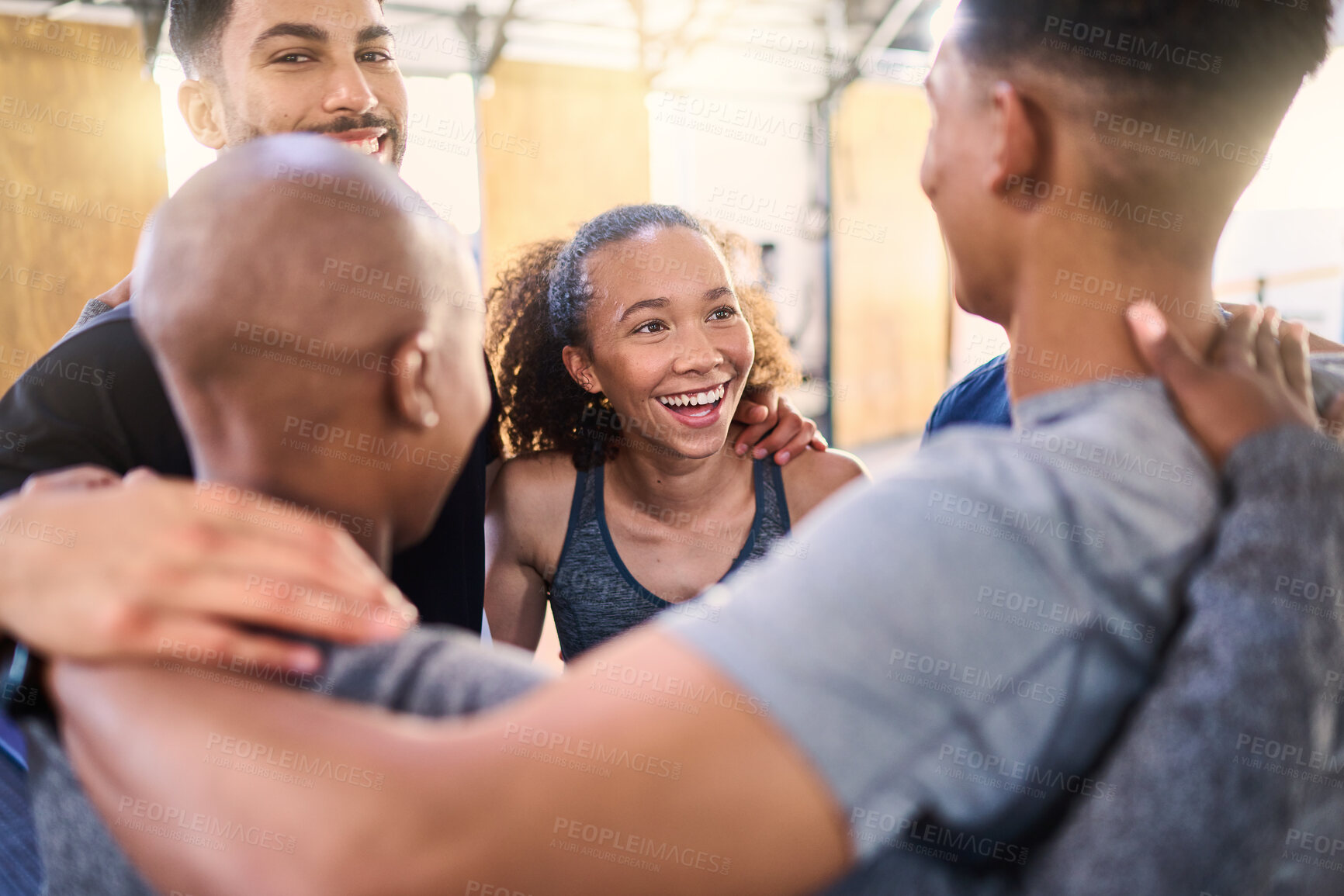 Buy stock photo Fitness, class and support hug of gym team and athlete group after exercise, sport and workout. Hugging training people and friends with happiness showing teamwork, sport community and motivation