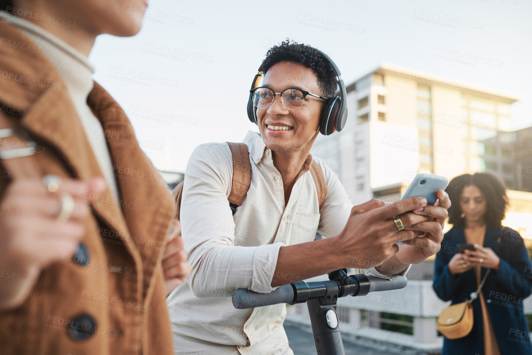 Buy stock photo Phone, electric scooter and transport with a black man in the city on his commute into work. Technology, street and communication with a male employee typing a message while on a scooter for travel