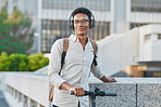 Black man, headphones and outdoor with scooter, in city and smile being casual, trendy and glasses. Gen z, travel and content to relax, happy or ready to commute being calm, happiness or eco friendly