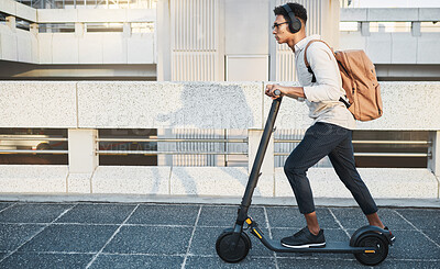 Buy stock photo City, travel and black man with eco scooter for net zero and eco friendly work commute in urban town. Environmental, carbon neutral and worker transportation with music or podcast on electric bike.