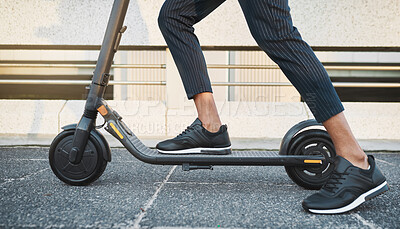 Buy stock photo Electric scooter, fashion and travel on a city street with black sneakers, energy and modern tech for eco friendly transportation. Future, hipster and energy of urban male legs on e scooter vehicle