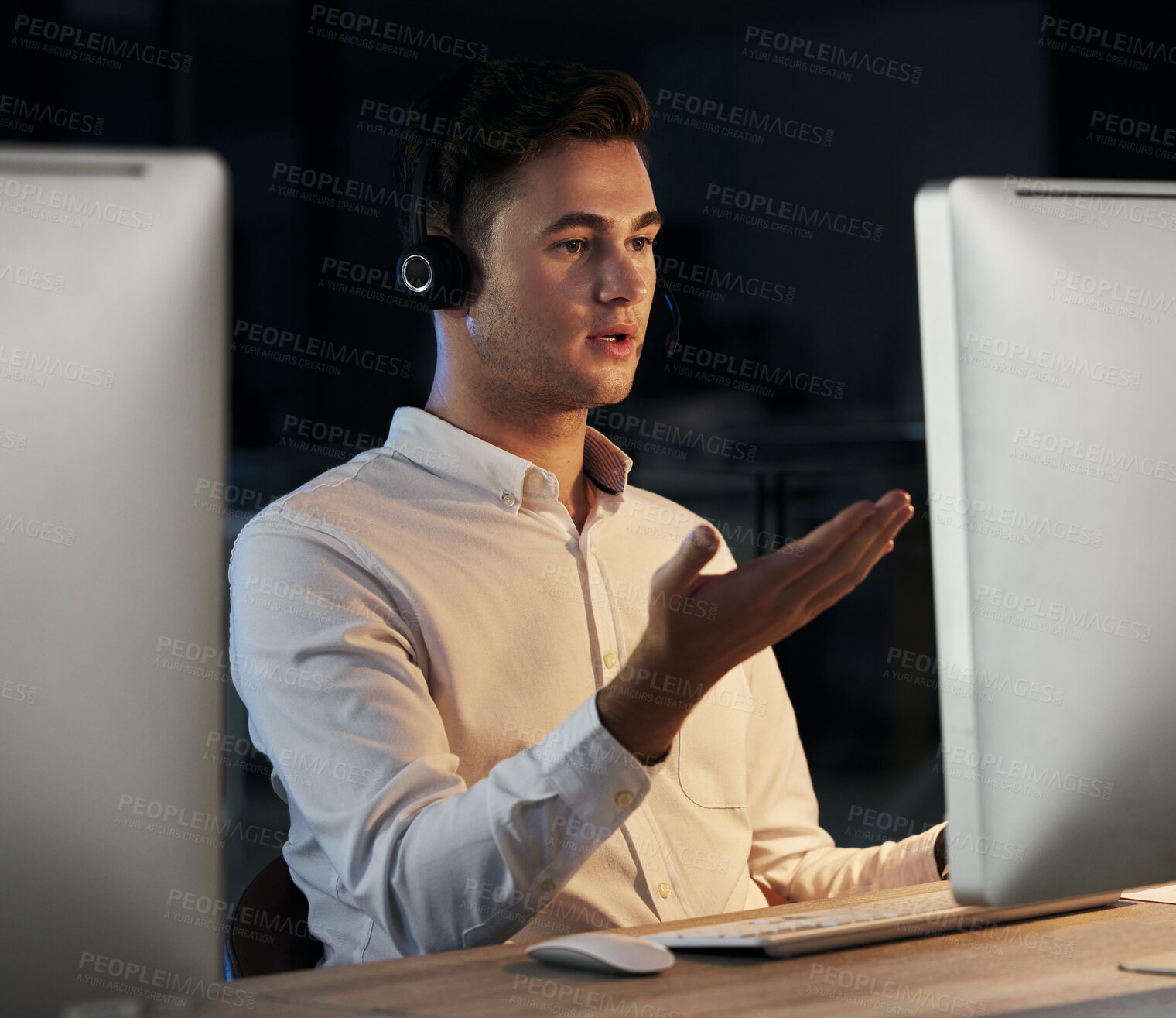 Buy stock photo Call center, night and man using, computer during consultation for telemarketing, sales and customers support in a dark CRM office. Male talking online for telecom, contact us and help with faq