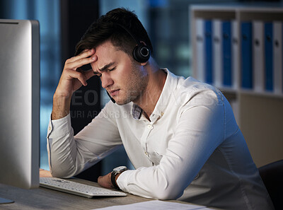Buy stock photo Stress, call center and customer service with a man consultant suffering with burnout while working late at night. Crm, ecommerce and compliance with a male employee working in retail or sales