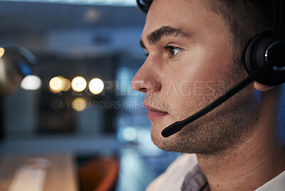 Buy stock photo Call center, night and face of man with microphone for consulting for customer service, telemarketing and sales in an office. Male working in CRM, contact us and telecom business for support and help