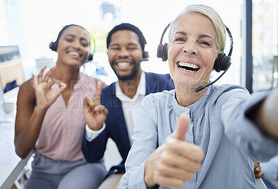 Buy stock photo Call center, group and selfie with smile, hand sign or diversity in workplace for friends together. Happy customer service, crm or photo portrait in office for solidarity, motivation or teamwork