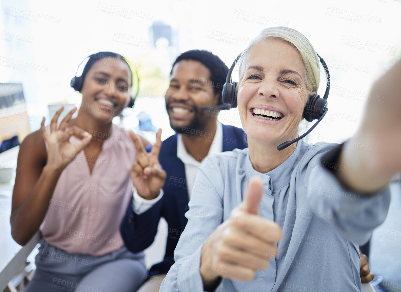 Buy stock photo Call center, selfie and employees with hand sign for support, motivation and thank you in telemarketing business. Thumbs up, photo and portrait of customer service people excited about consulting