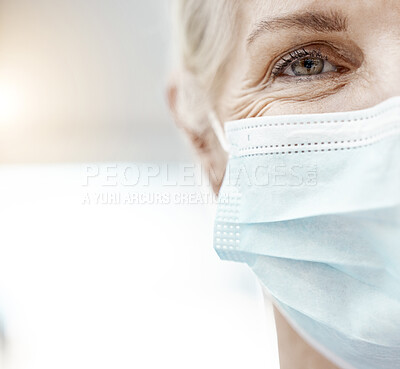 Buy stock photo Covid, face and eye with a senior woman in a mask for safety or protection with mockup inside. Medical, health and portrait with a mature female sick during the corona virus pandemic or outbreak