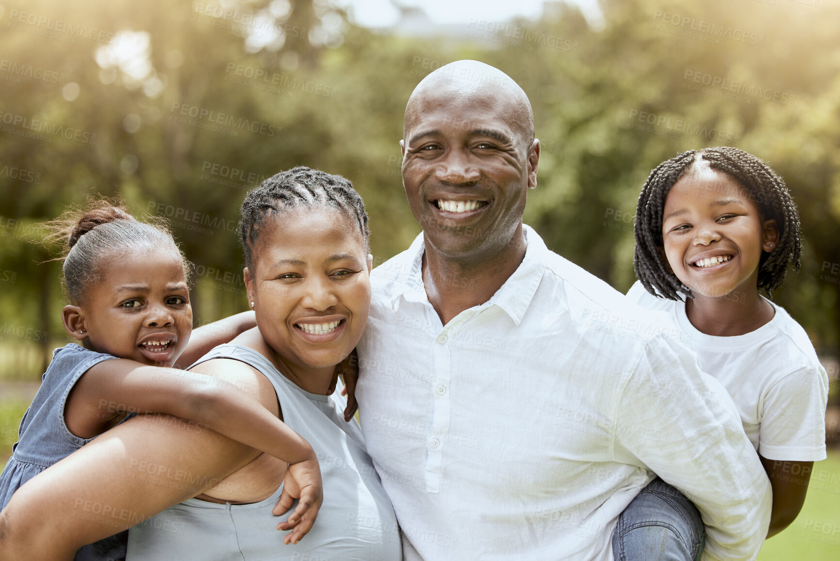 Buy stock photo Black family, piggyback and children with a mother and father carrying their daughter siblings outdoor in a park. Portrait, happy and love with a man, woman and kids bonding together in nature