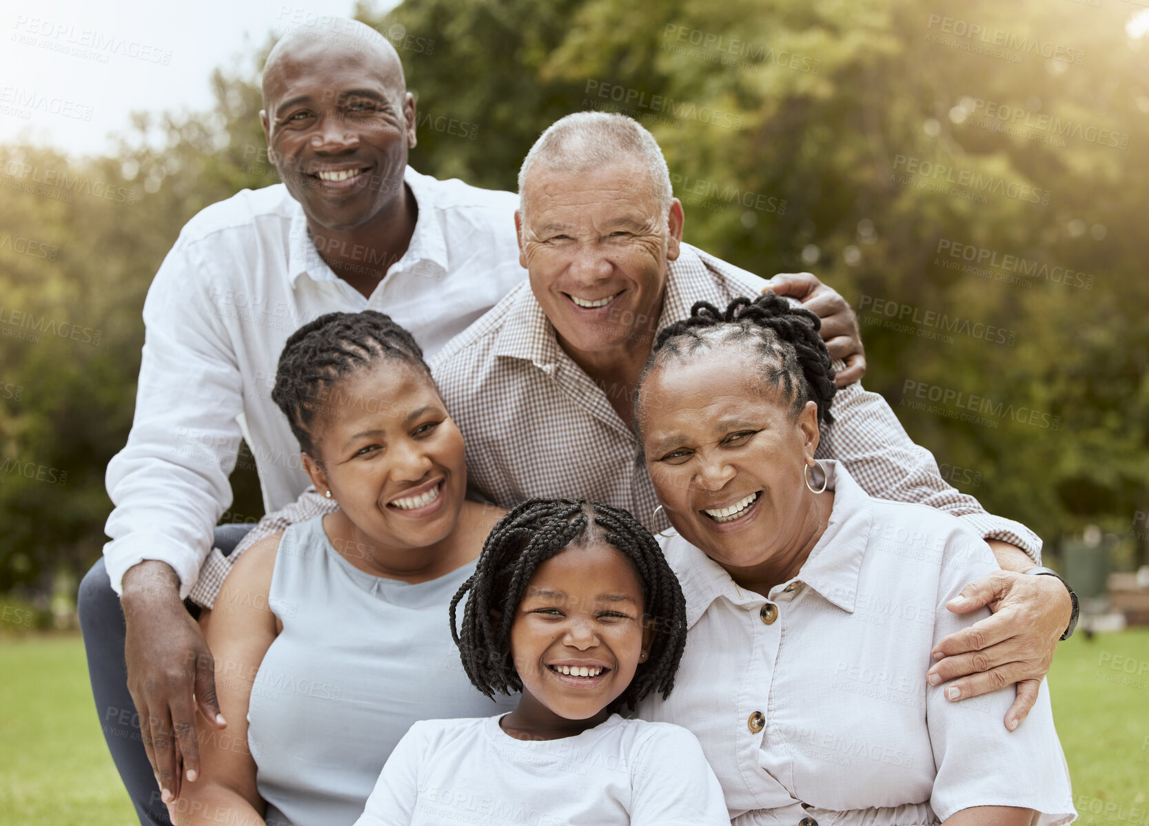 Buy stock photo Happy black family, hug and portrait smile for quality bonding happiness together for outdoor fun in nature. Mother, father and grandparents with kid smiling for family vacation or holiday at a park