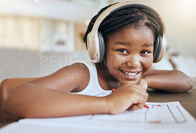 Buy stock photo Online education, headphones and african girl in portrait writing, drawing and learning at home in virtual class happy with her language audio assessment. Black student child in elearning video call
